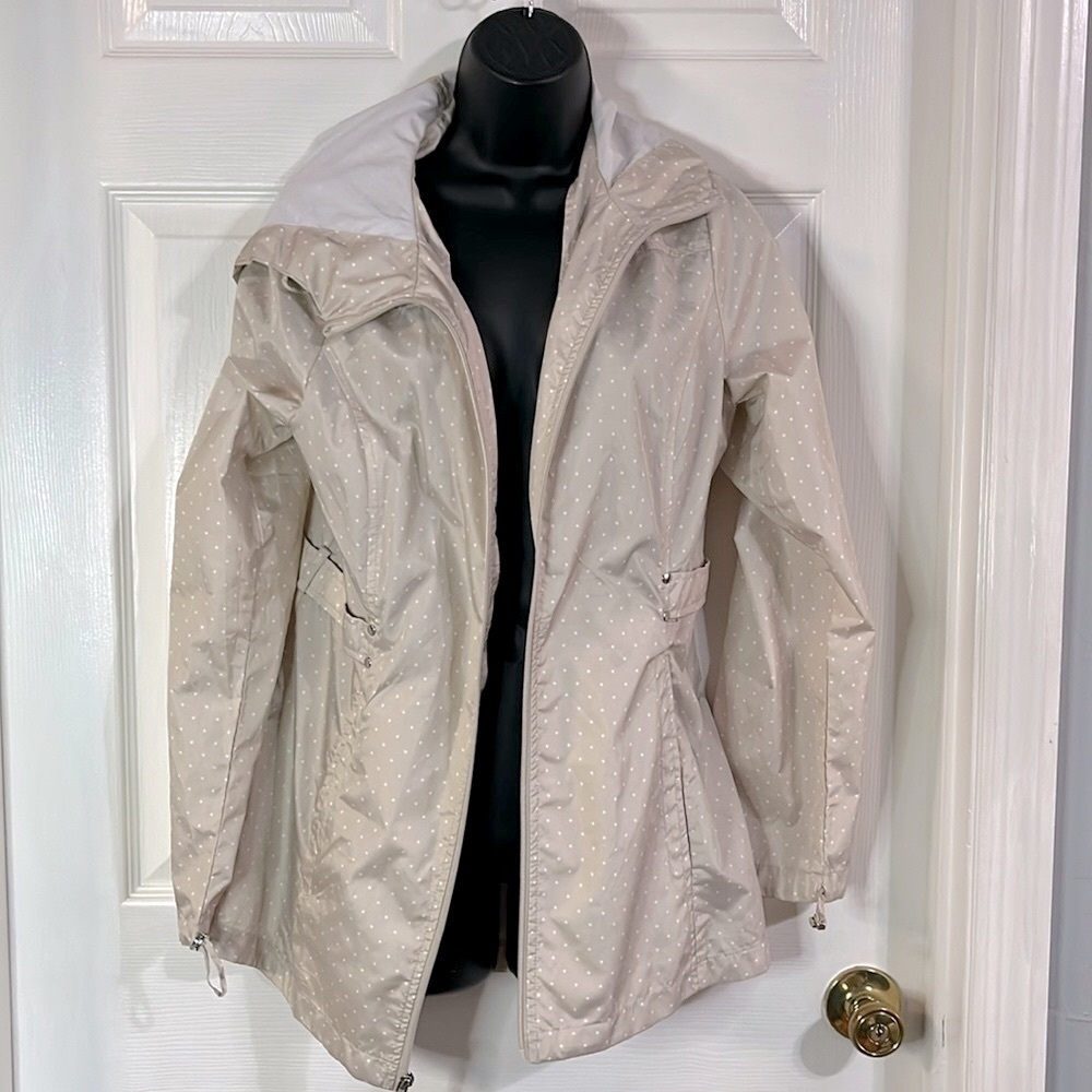 Jones New York beige hooded windbreaker with white polka dots, size medium.